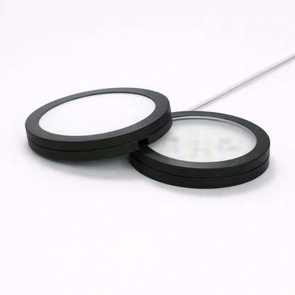 Two circular black filters on a white background