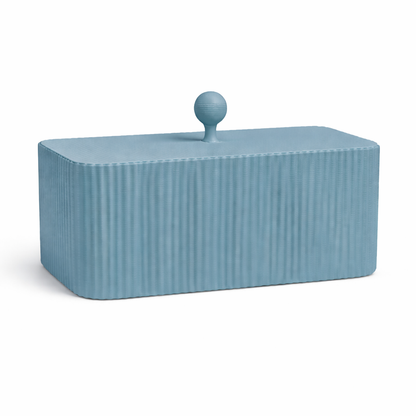 Blue ribbed container with a spherical handle on a white background