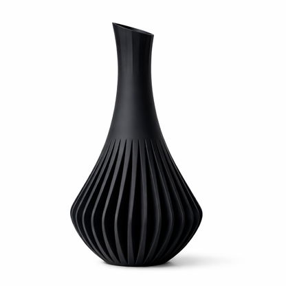 Black vase with ribbed texture on a white background