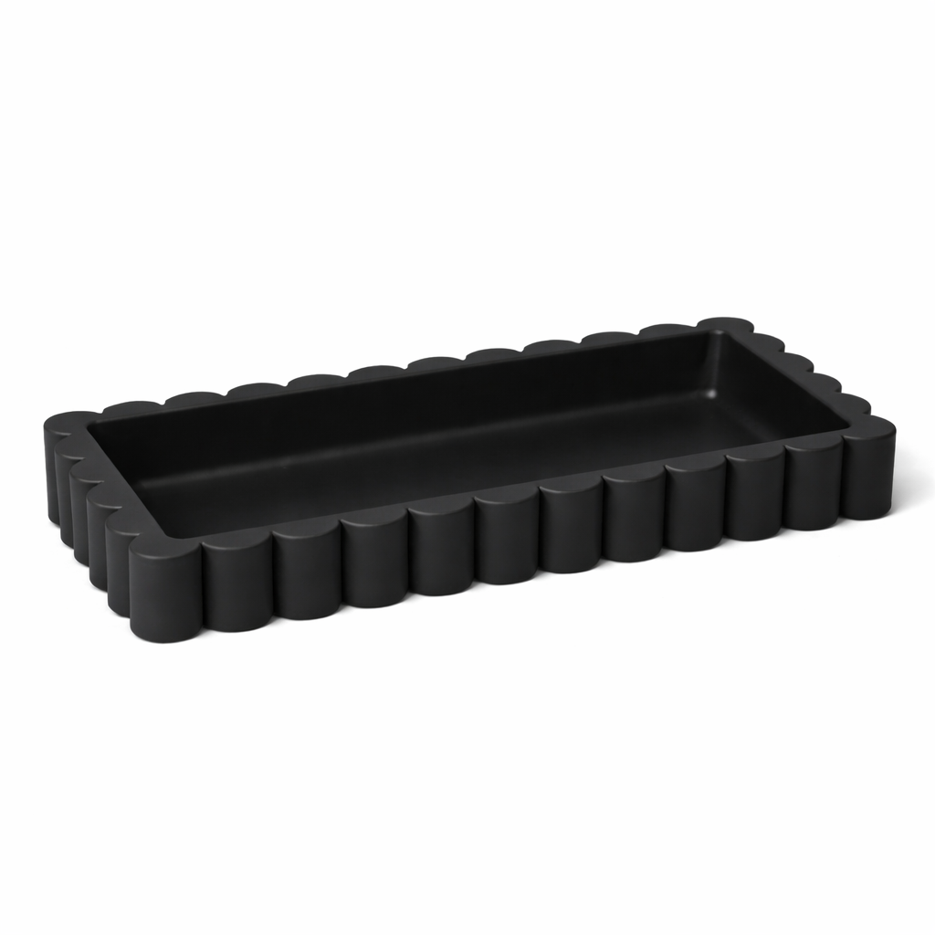 Black rectangular tray with textured edge on a white background