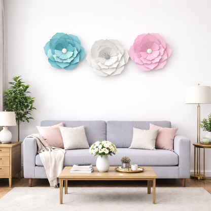 Living room with a gray sofa, decorative flowers on the wall, and a coffee table with a vase of flowers.
