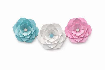 Three paper flowers in blue, white, and pink on a white background