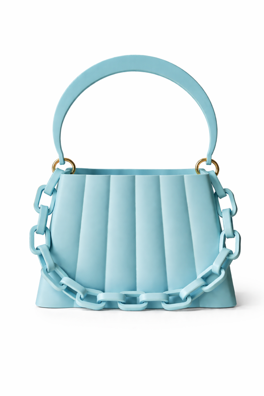 Light blue handbag with chain details on a white background