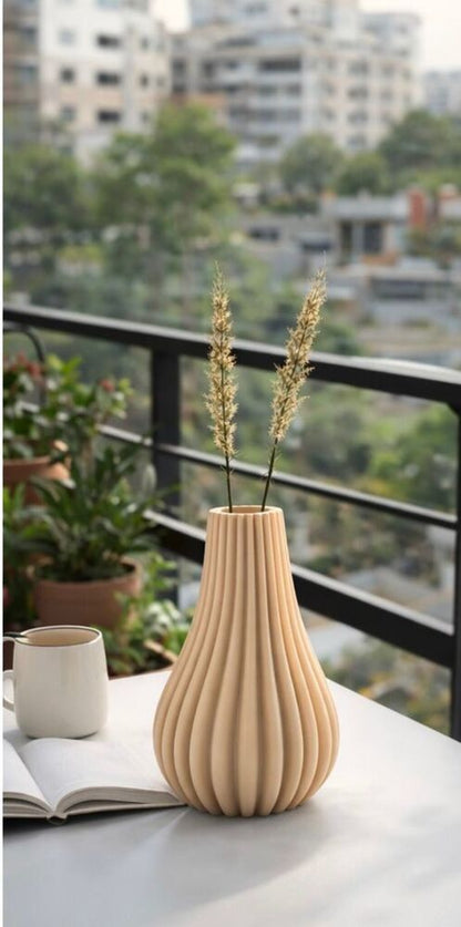 Wooden vase with dried plants on a table with a cityscape background