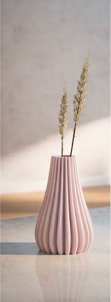 Spiral ribbed decorative vase for modern home decor. Elegant minimalist design perfect for table styling, living room decoration and flower display.