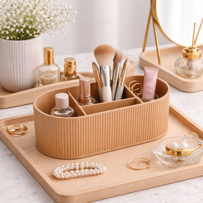 Cosmetic organizer with makeup brushes, bottles, and jewelry on a wooden tray.