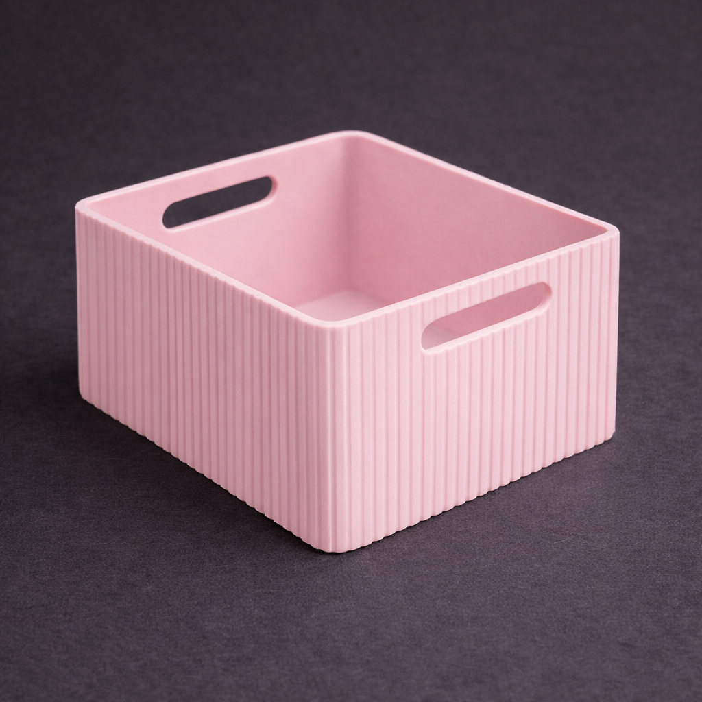 Pink storage basket with handles on a dark background