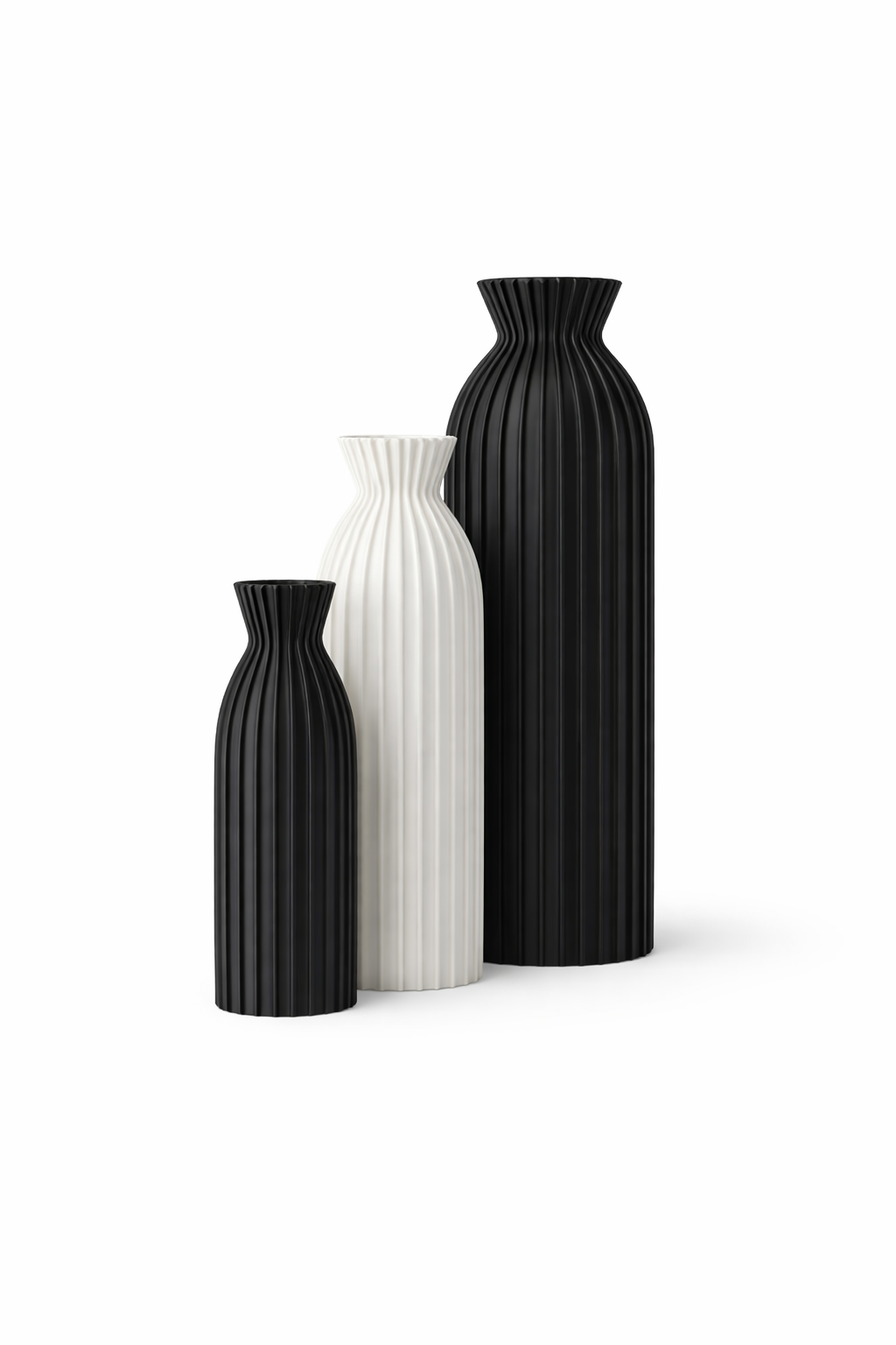 Three black and white vases of different sizes on a white background
