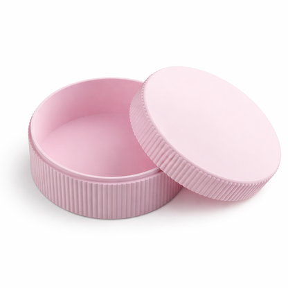 Pink container with lid on a white background
