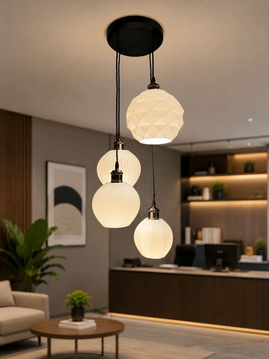 Modern pendant light fixture with glass shades in a living room setting.