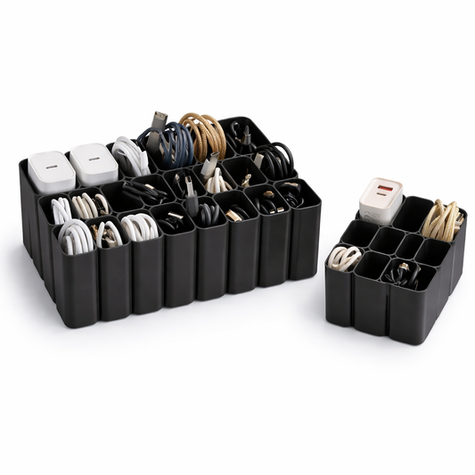 Black cable organizer with compartments holding various electronic accessories on a white background