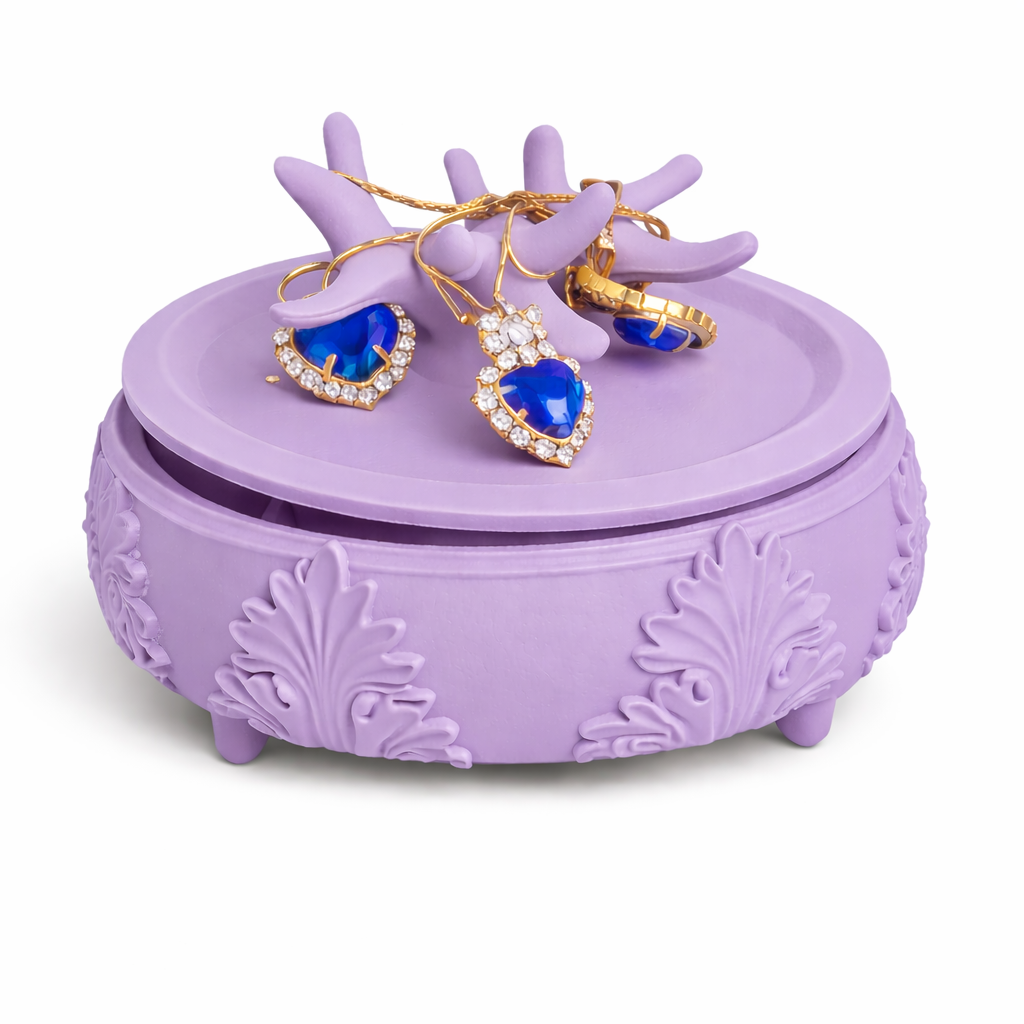Purple jewelry box with heart-shaped blue earrings on a white background