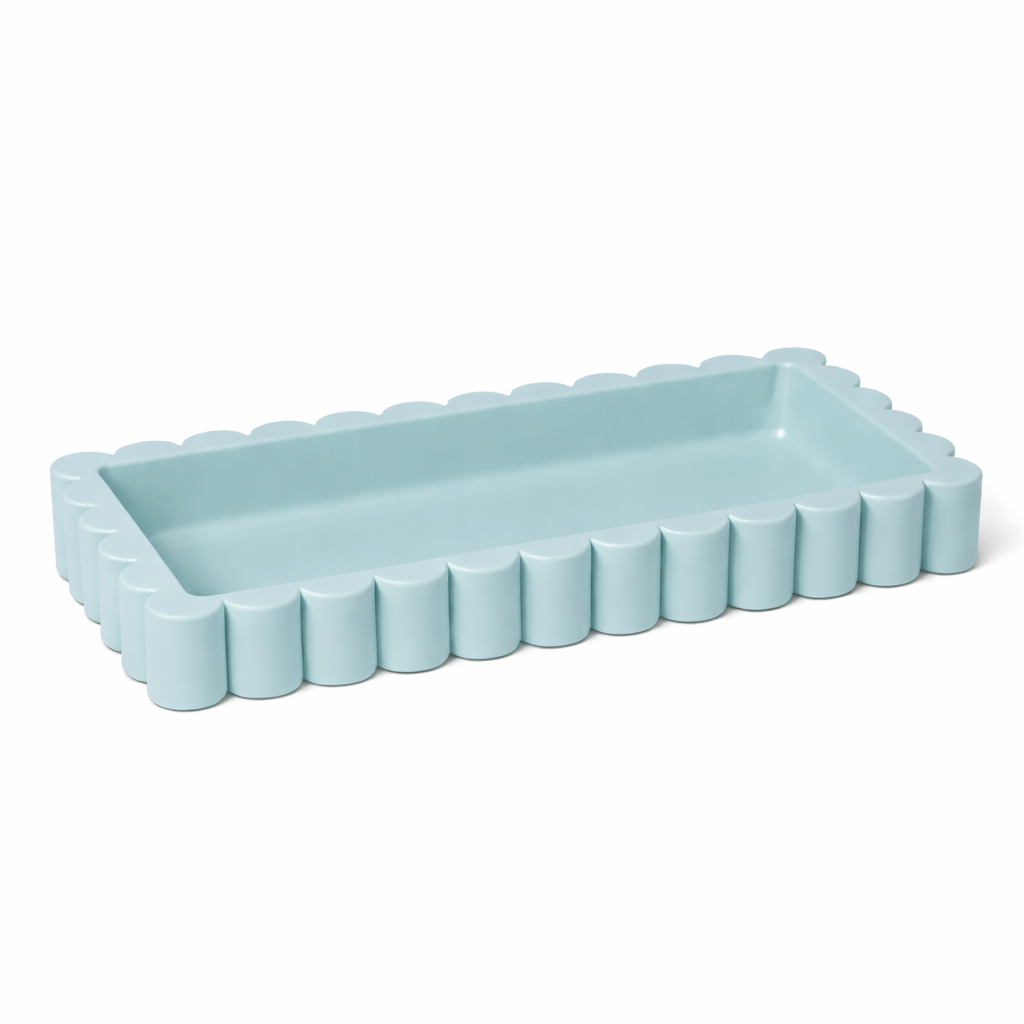 Light blue rectangular tray with decorative edge on a white background