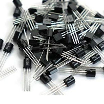 Pile of electronic transistors on a white background