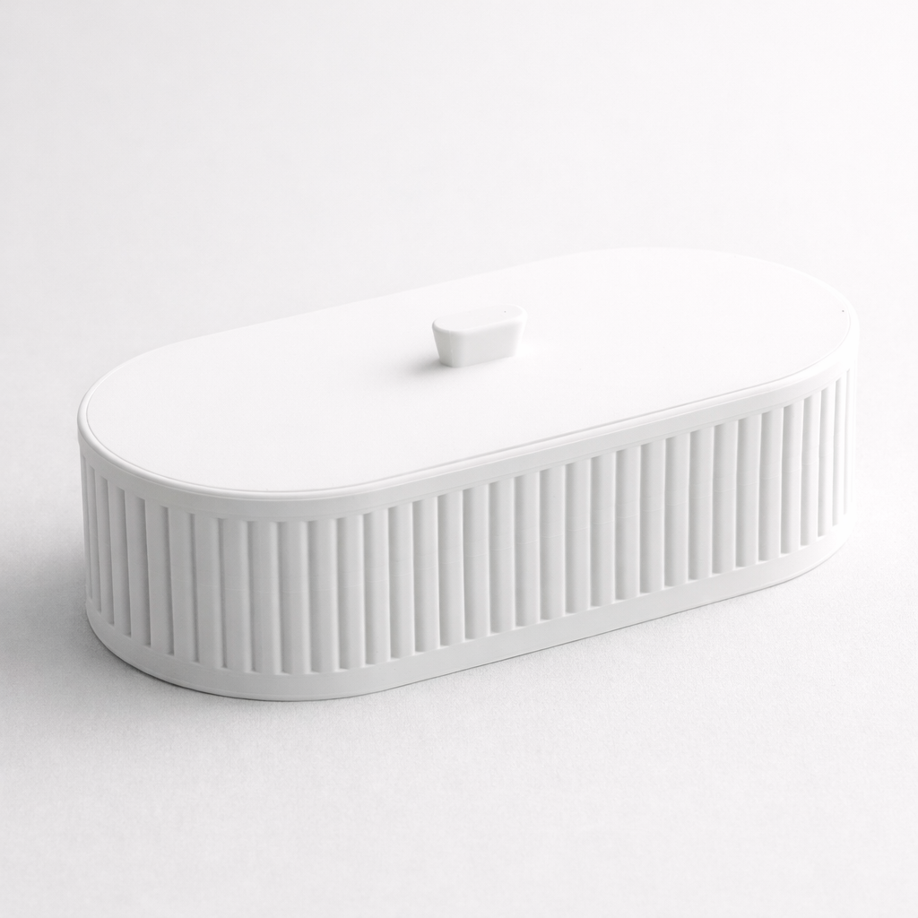 White ceramic sink with ribbed design on a white background