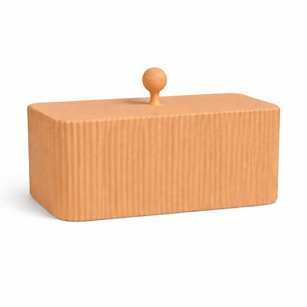 Rectangular wooden box with a textured surface and a round handle on a white background