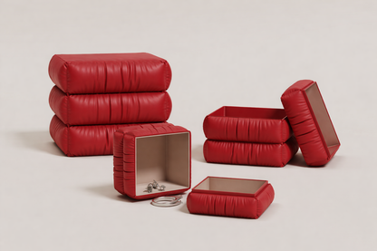 Red leather furniture pieces on a light gray background