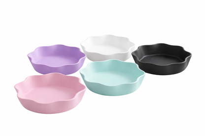 Set of five colorful ceramic bowls on a white background