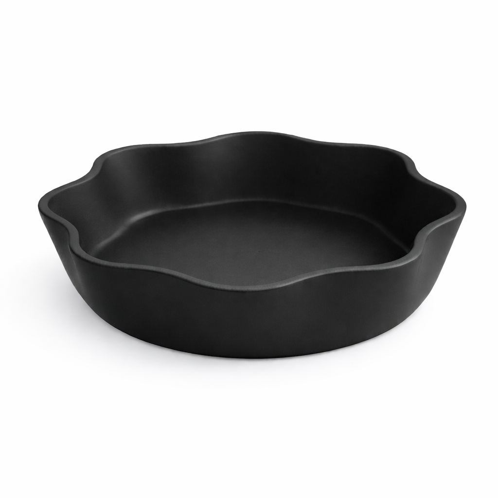 Black ceramic baking dish on a white background