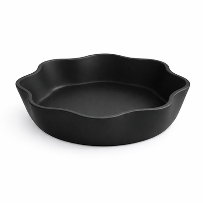 Black ceramic baking dish on a white background