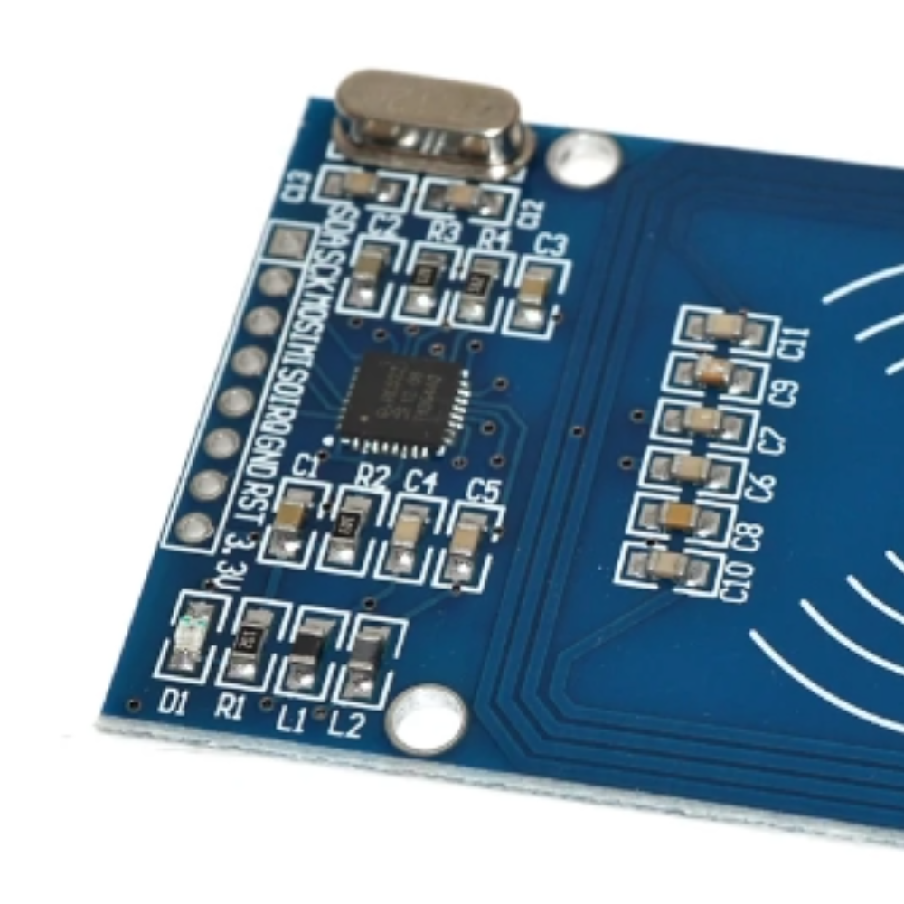 Close-up of a blue electronic circuit board with components on a white background