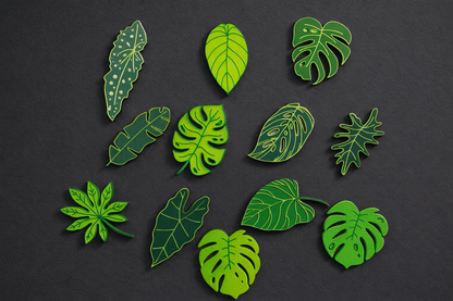Green leaf-shaped pins on a black background
