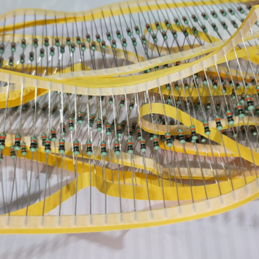 Close-up of a resistor stack with yellow bands on a white background
