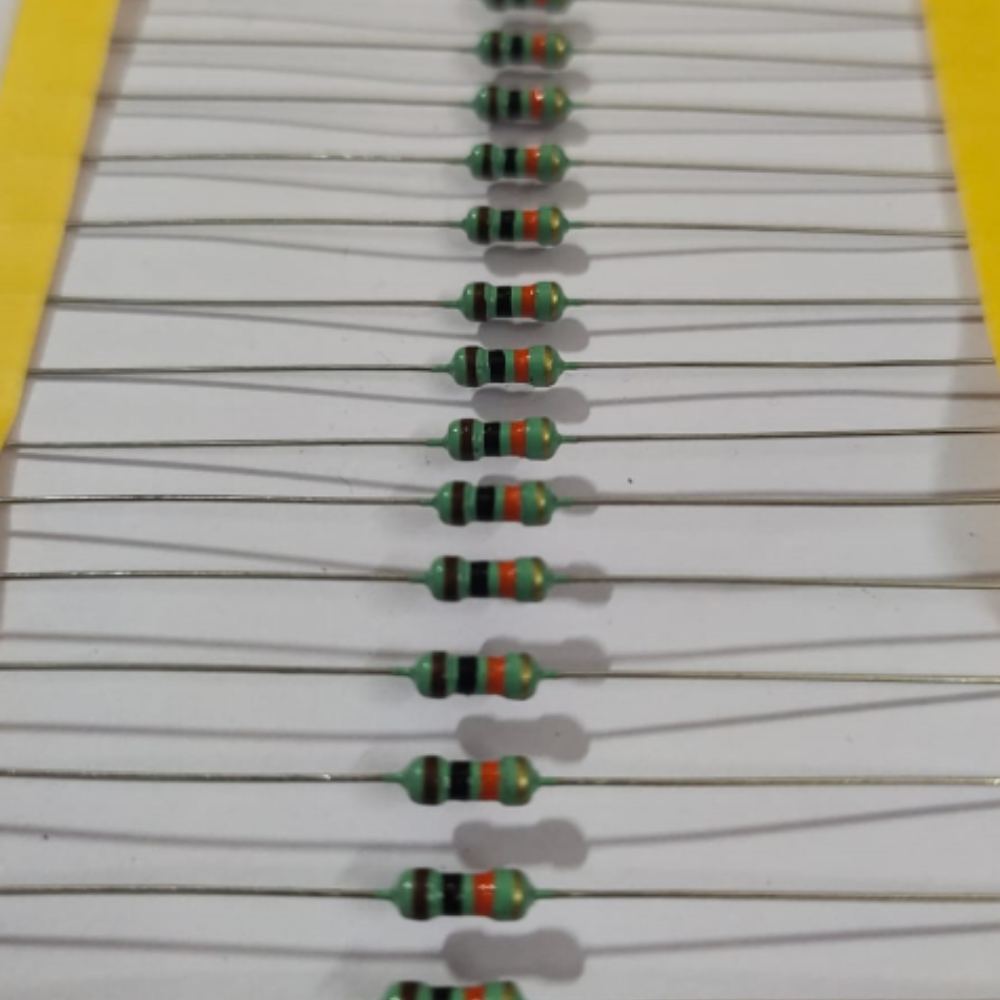 Row of resistors with color bands on a white background