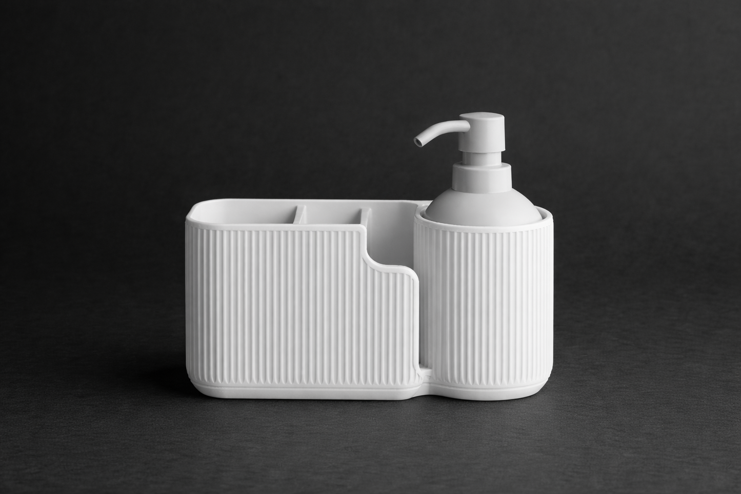 White ceramic soap dispenser with holder on a black background