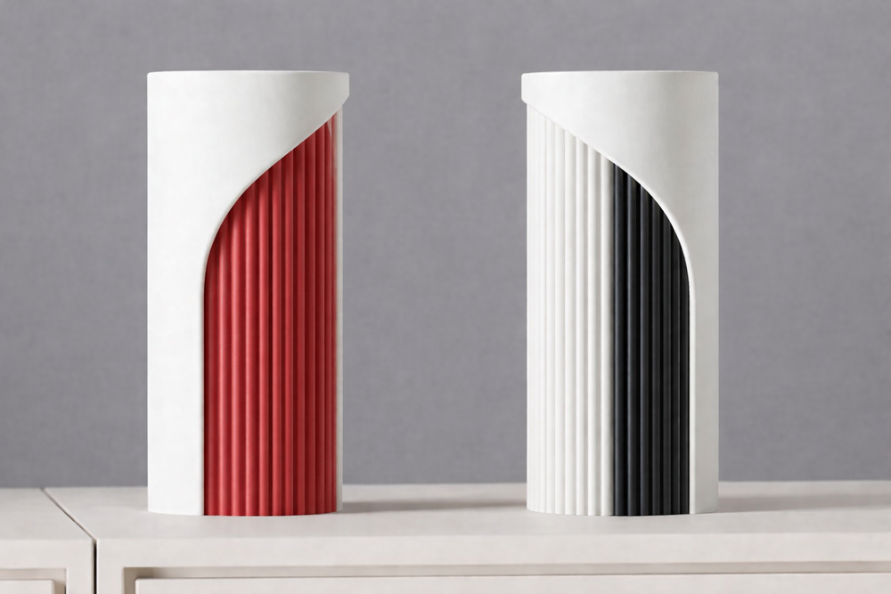 Two modern vases with red and black interior designs on a gray background