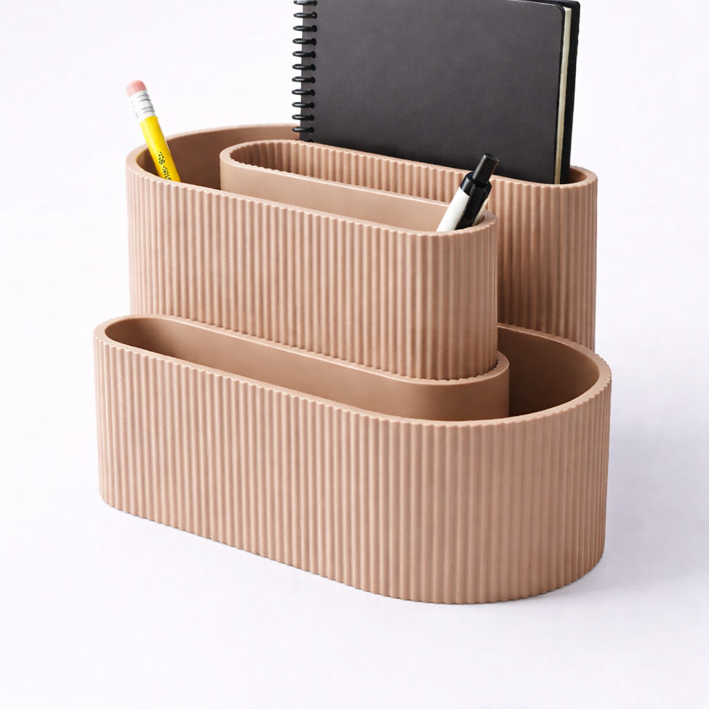Beige ribbed desk organizer with stationery items on a white background