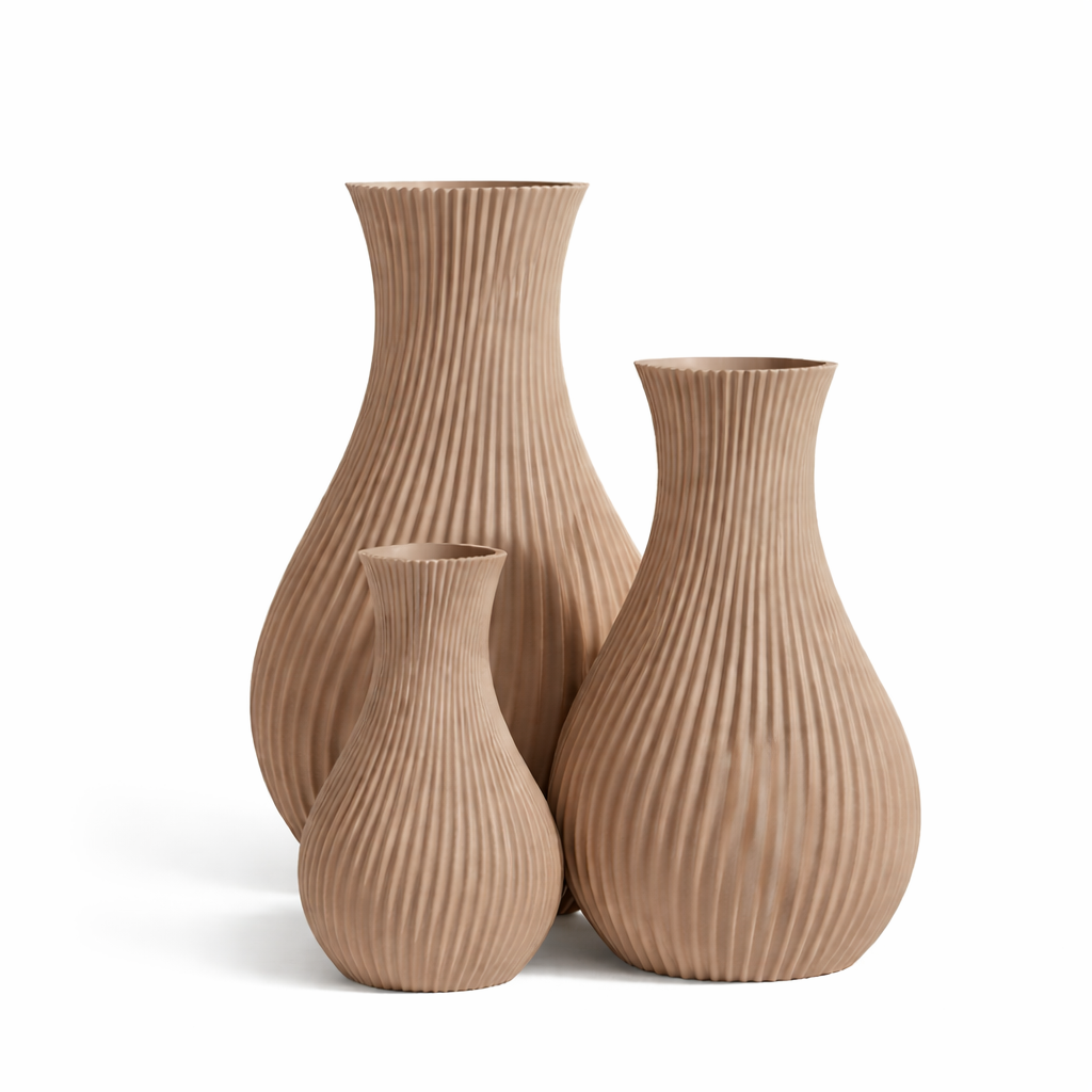 Three ribbed vases of different sizes on a white background