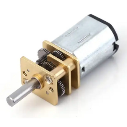 Mechanical gear unit with gold casing on a white background
