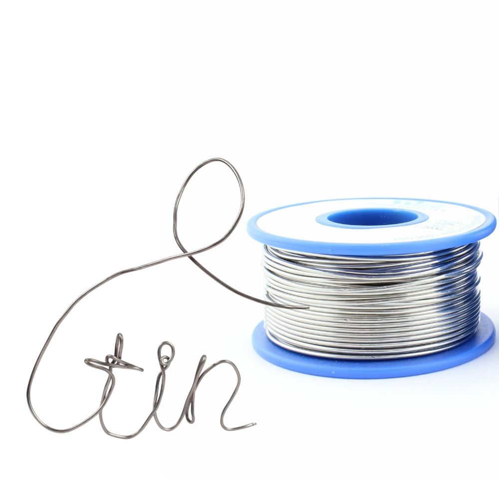 Spool of tin wire on a white background