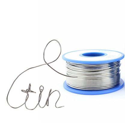 Spool of tin wire on a white background