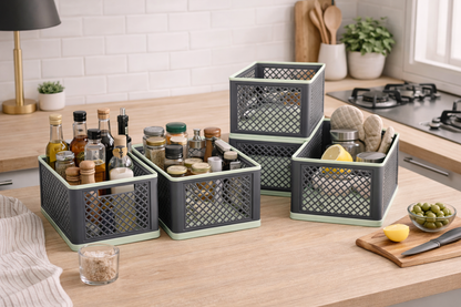 Set of gray storage baskets on a kitchen counter with various items.