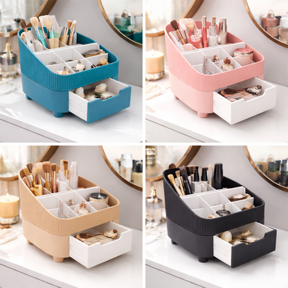Four different colored cosmetic organizers with compartments and drawers on a vanity.