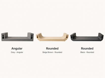 Three wall hooks in different styles and colors on a white background