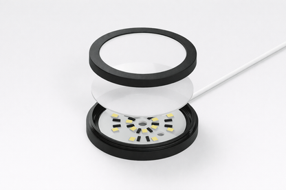 Close-up of a cylindrical electronic component with LED lights on a white background