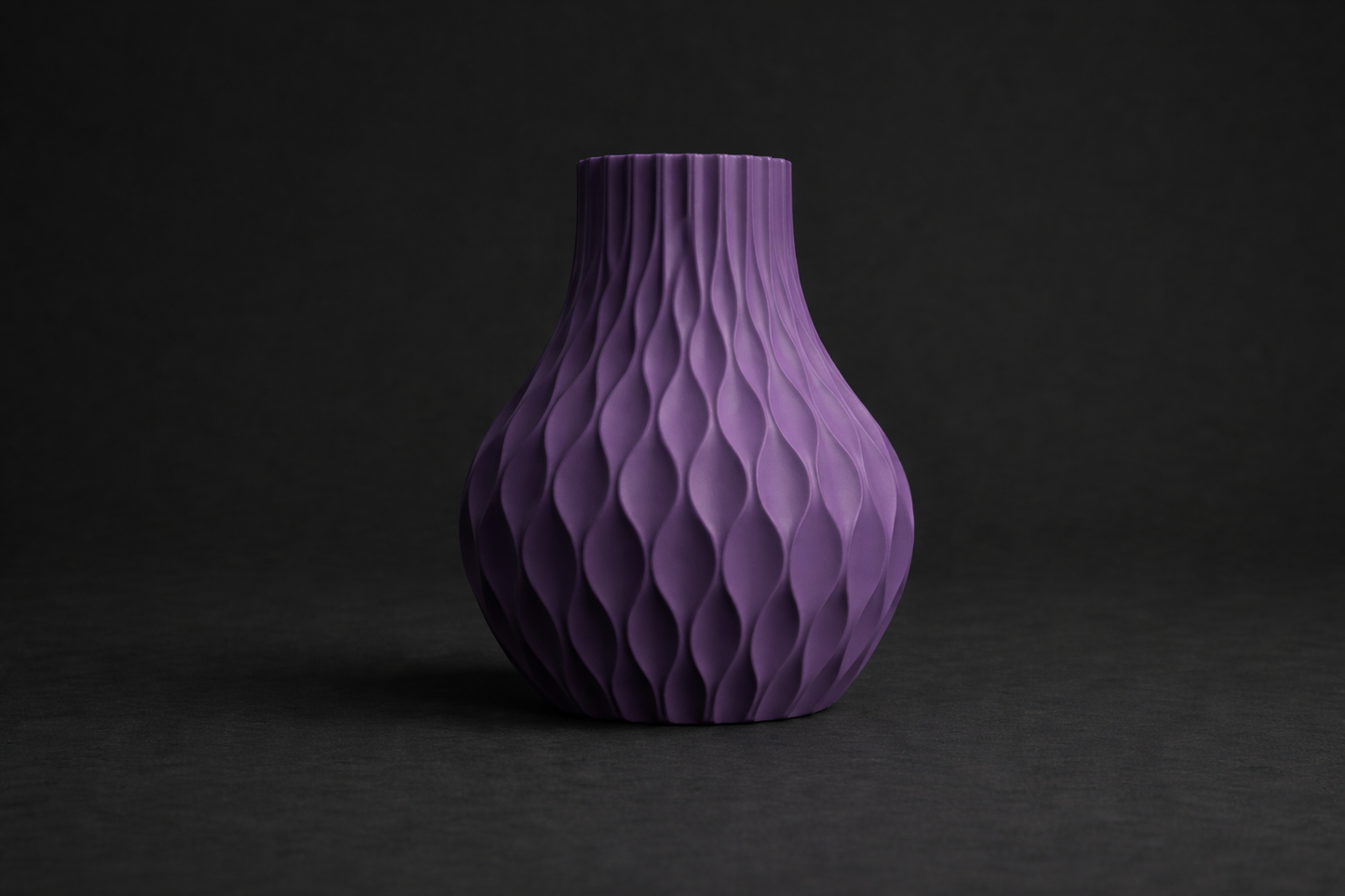 Purple textured vase on a dark background