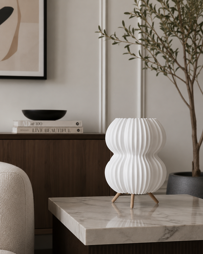 White matte bubble-style table lamp with tripod base for modern bedroom and living room décor
