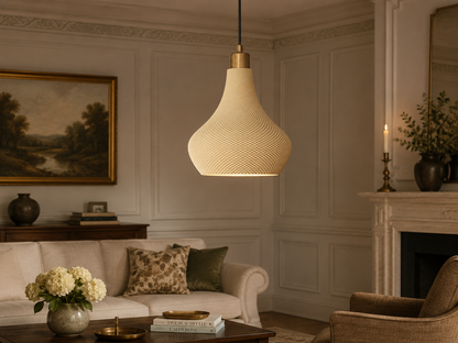Living room with a hanging lamp, sofa, and fireplace.