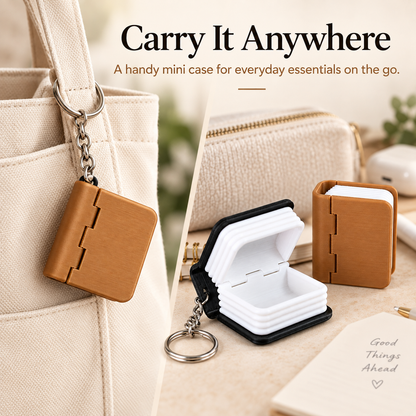 A mini book-shaped keychain case shown in a split lifestyle studio scene. One side shows the tan-brown case hanging from a cream canvas tote bag, with text reading 'Carry It Anywhere.
