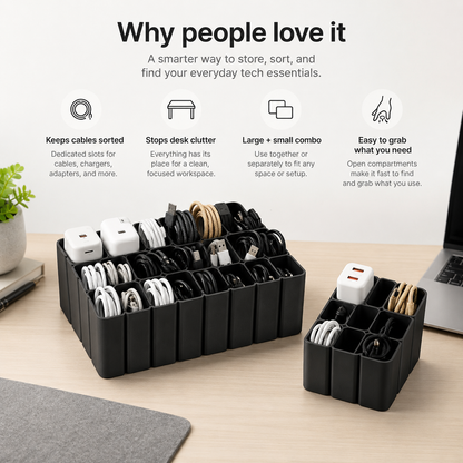 A black cable organizer tray set on a light wood desk, holding various charging cables and adapters. The scene includes marketing text at the top and parts of a plant, notebook, and laptop on the desk, making it a lifestyle/product demonstration shot.