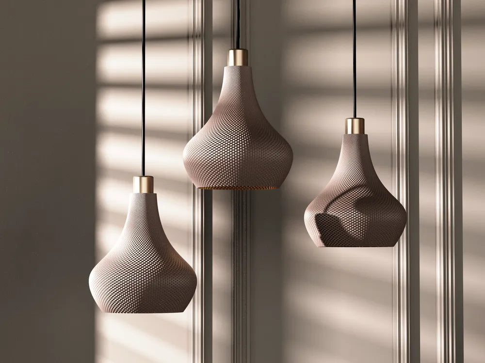 Three hanging pendant lights with a textured design against a neutral background