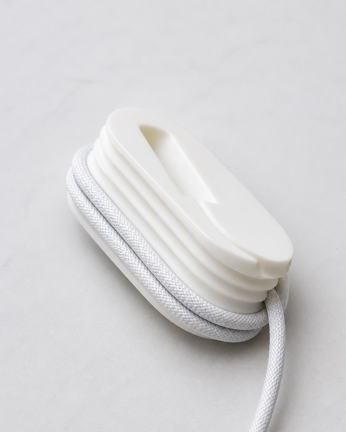 Compact charging cable organizer for keeping USB-C wires neat on desk, drawer, bag and travel pouch