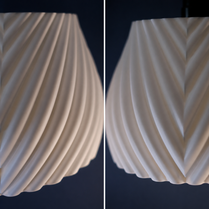 Close-up of a textured white ceramic object against a dark background