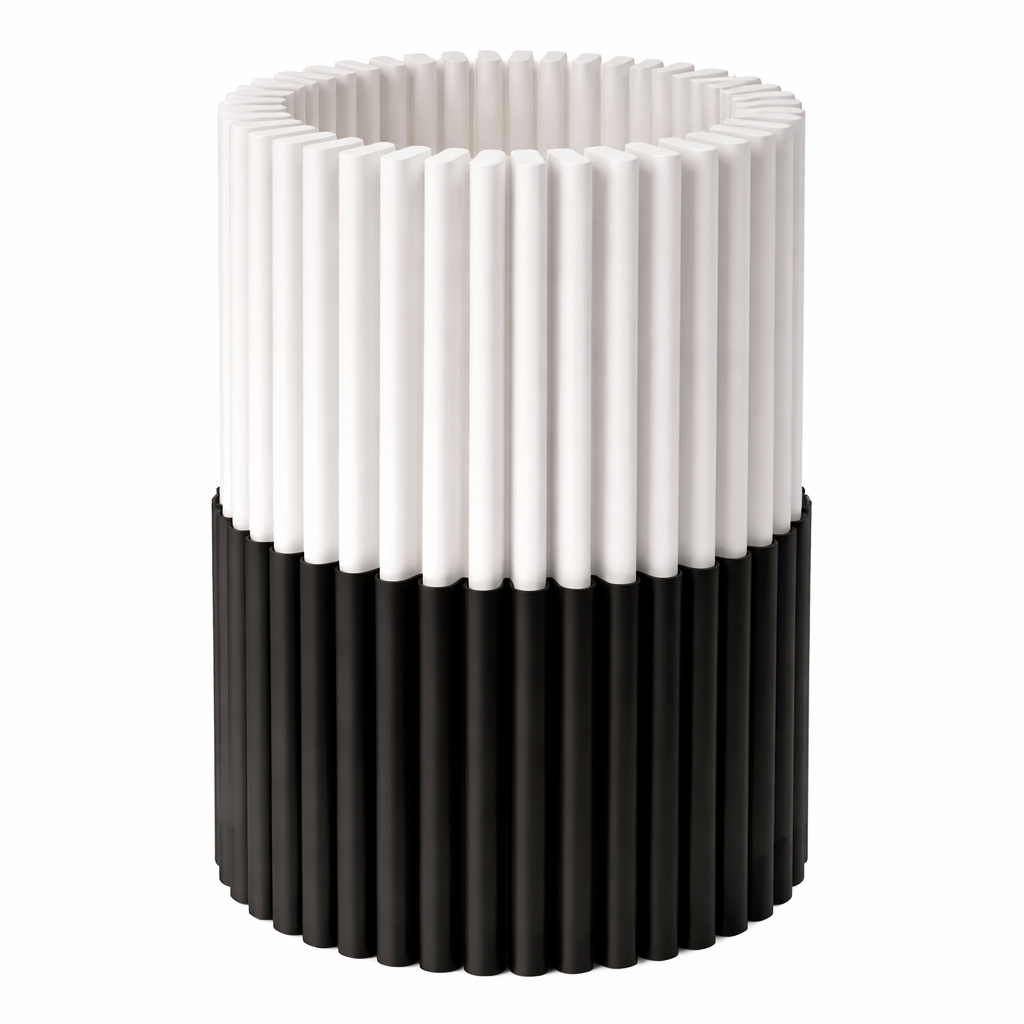 Cylindrical vase with alternating white and black ribbed design on a white background