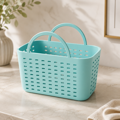 A light aqua blue plastic laundry basket with two loop handles, shown on a light marble countertop in a bright, modern room setting.