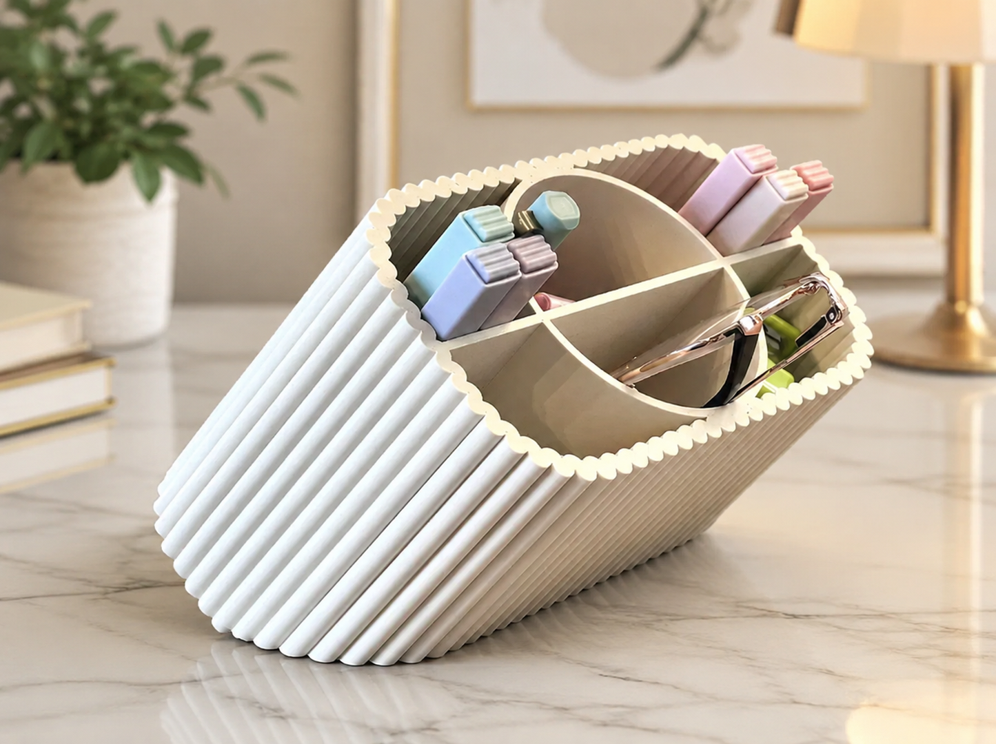 A ribbed, pleated desk organizer in a warm off-white/cream color, styled on a marble desk with pens, sticky notes, and glasses inside.